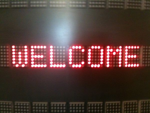 Reddish-orange lights spelling out WELCOME